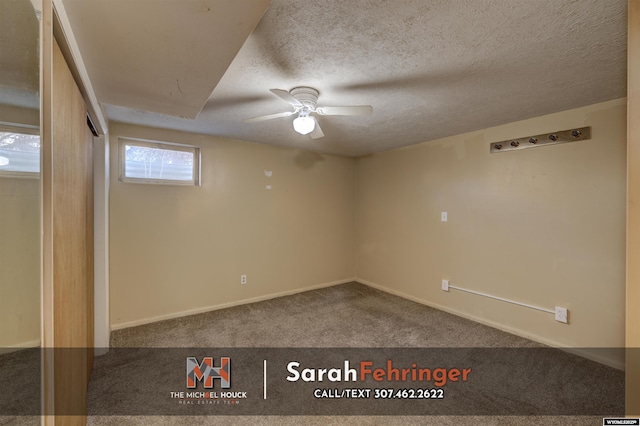 unfurnished room featuring baseboards, a textured ceiling, ceiling fan, and carpet flooring