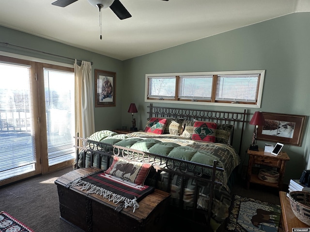 bedroom featuring a ceiling fan, access to exterior, carpet, and vaulted ceiling