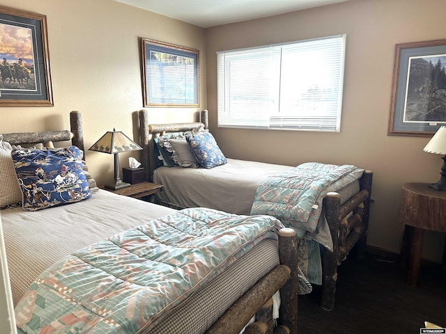 bedroom with wood finished floors