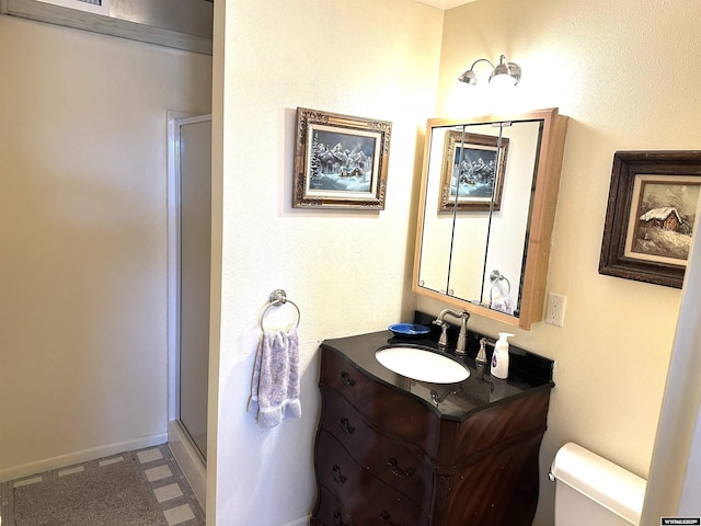 full bath featuring tile patterned floors, a shower stall, toilet, and vanity