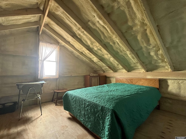 bedroom with lofted ceiling