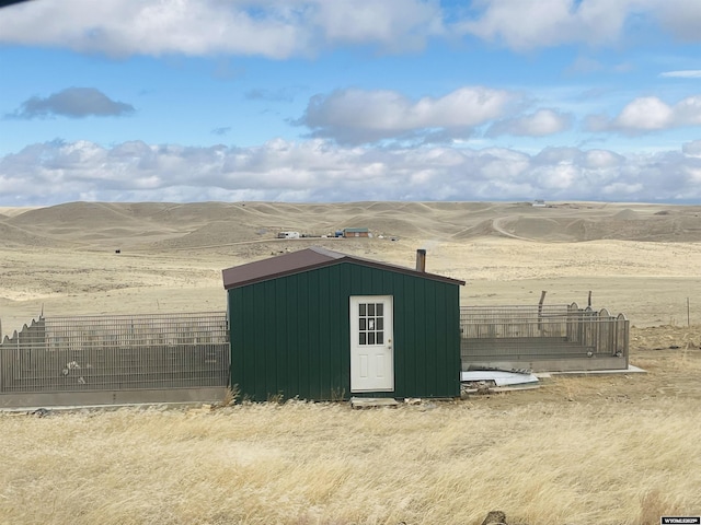 view of shed with fence