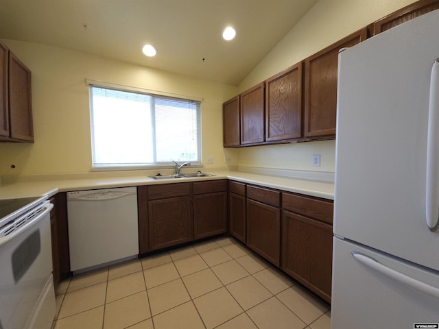 kitchen featuring a sink, white appliances, recessed lighting, and light tile patterned floors