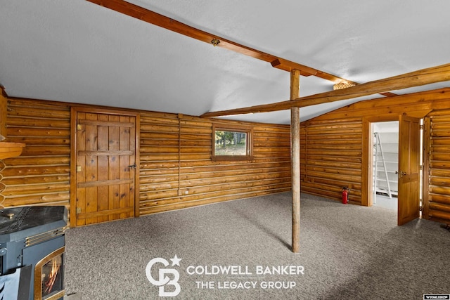 interior space featuring log walls, carpet floors, a textured ceiling, and vaulted ceiling with beams