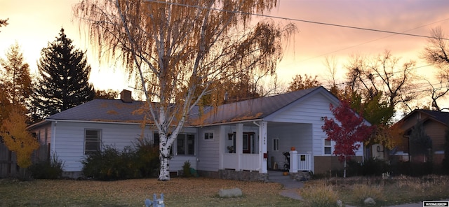 846 S 4th St, Lander, WY 82520 - ranch-style home featuring a porch and a chimney