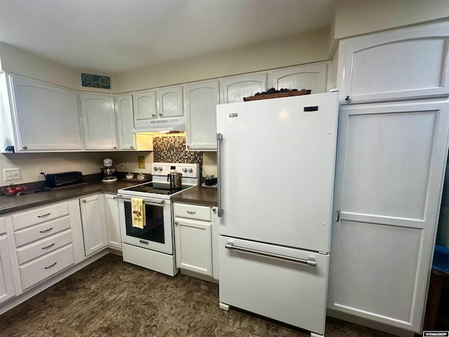 kitchen featuring under cabinet range hood, white appliances, white cabinetry, and dark countertops