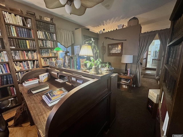 sitting room featuring a ceiling fan