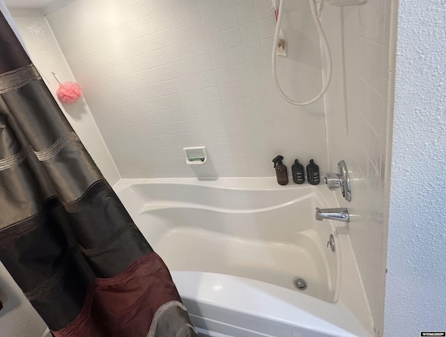 full bath featuring shower / tub combo with curtain