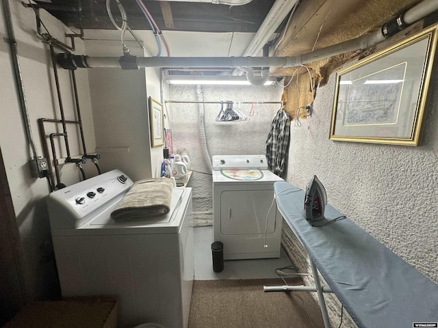 washroom with washer and dryer and laundry area