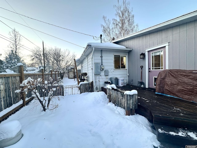 exterior space with a deck and fence