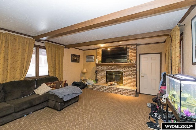 living area featuring beamed ceiling, a fireplace, a textured ceiling, and carpet