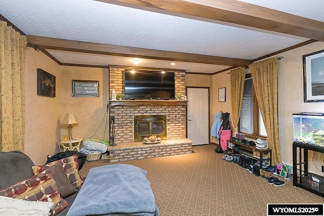 living area with beam ceiling, a brick fireplace, and carpet