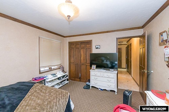 bedroom with a closet and ornamental molding