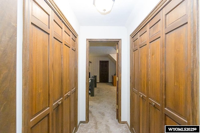 corridor with light colored carpet