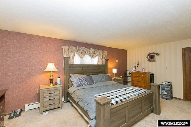 bedroom featuring a baseboard radiator, baseboards, and light colored carpet