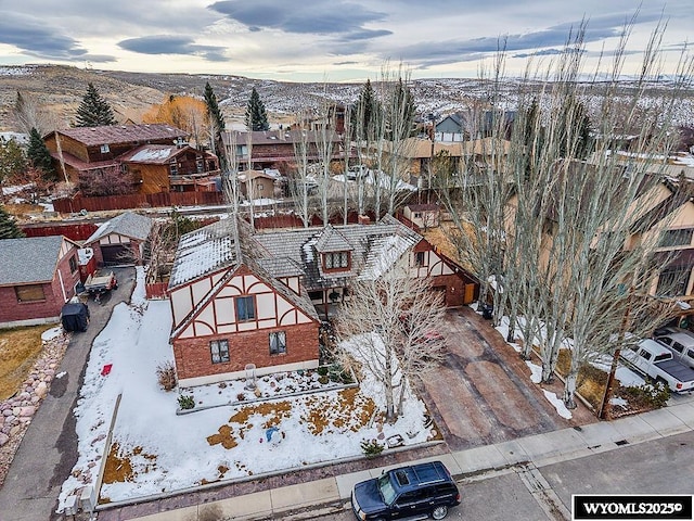 snowy aerial view with a residential view