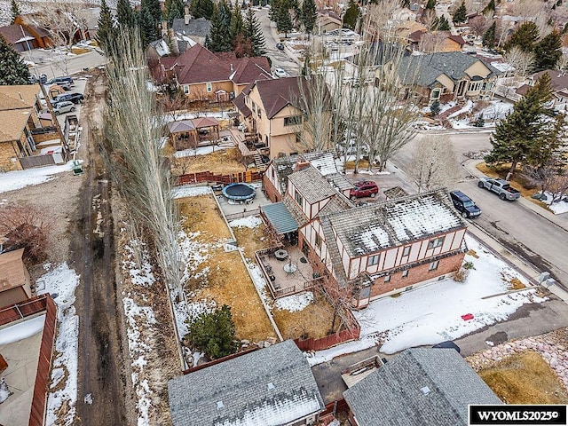 snowy aerial view featuring a residential view