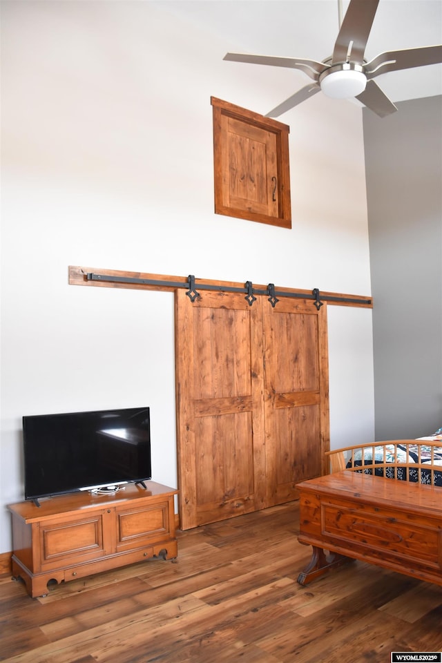 interior space with ceiling fan and wood finished floors