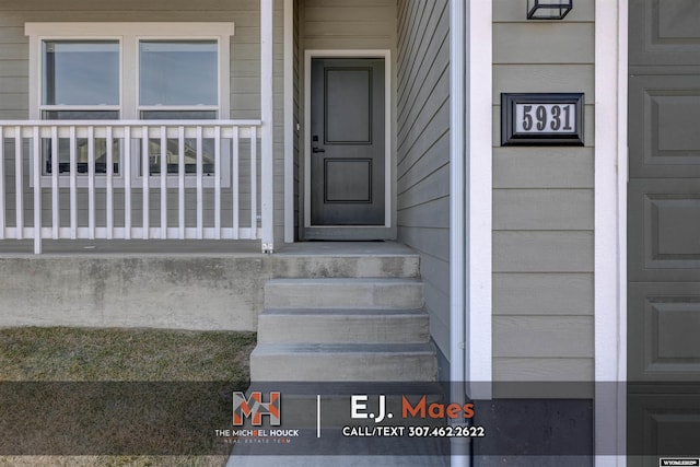 property entrance featuring covered porch