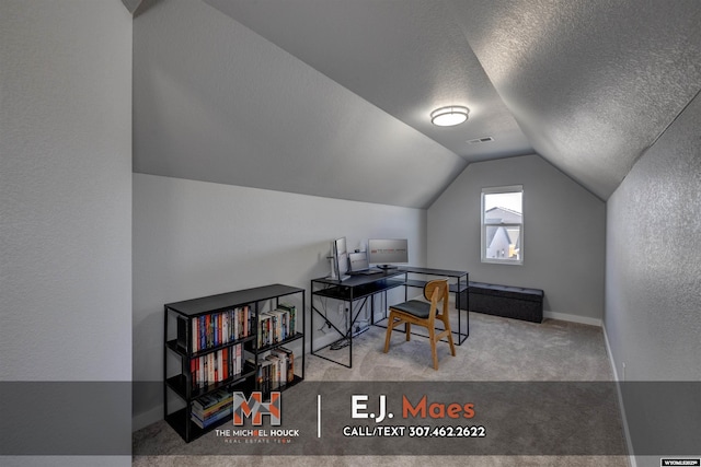 office space featuring carpet, visible vents, baseboards, lofted ceiling, and a textured ceiling