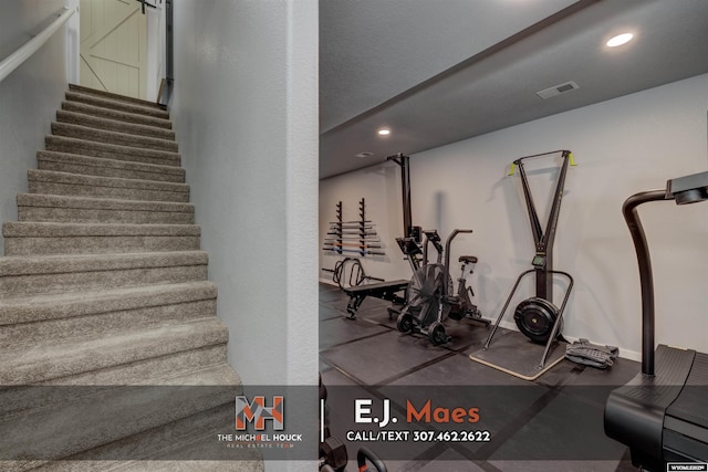 stairway with visible vents, recessed lighting, and baseboards