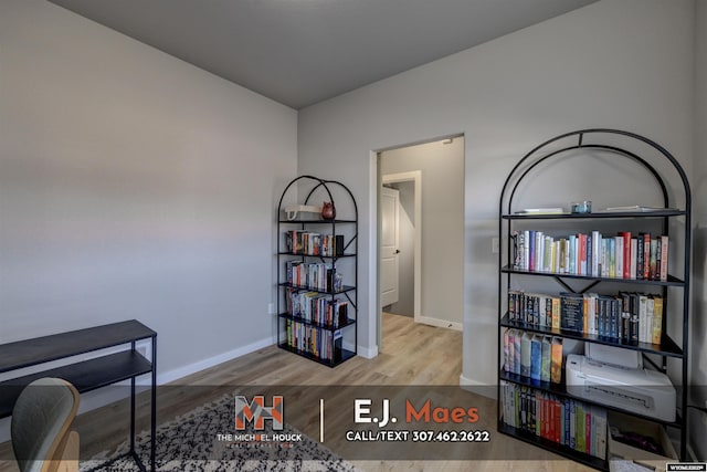 home office featuring wood finished floors and baseboards