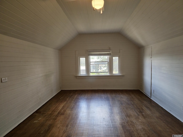 bonus room featuring lofted ceiling and dark wood finished floors