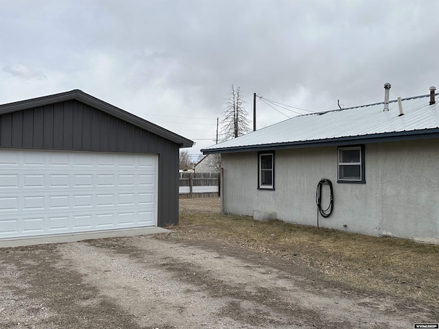 garage featuring fence