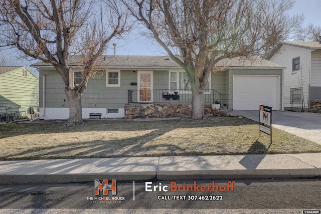 single story home with a garage and concrete driveway