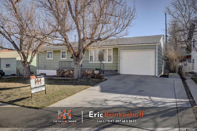 single story home with covered porch, concrete driveway, and a garage