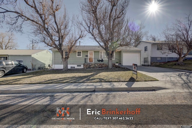 view of front of home featuring concrete driveway and a garage