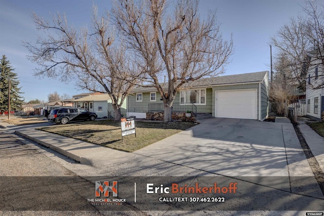 view of front of home featuring concrete driveway and a garage