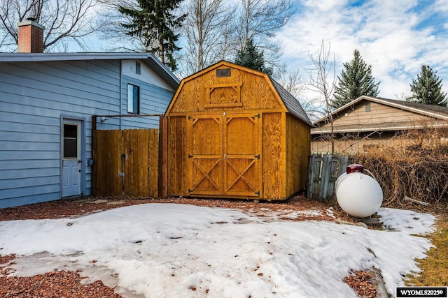 view of shed with fence