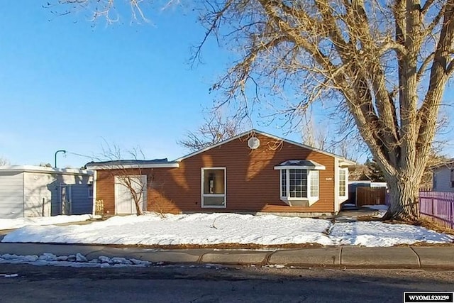 1711 Elk Ave, Casper, WY 82601 - view of front facade with an attached garage and fence
