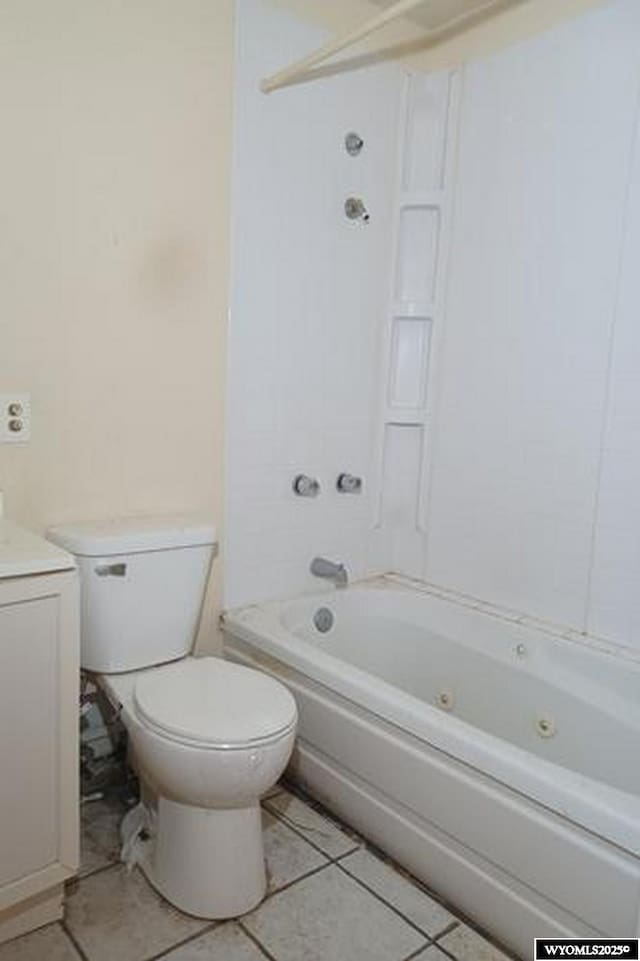 1711 Elk Ave, Casper, WY 82601 - bathroom with tile patterned floors, shower / tub combination, vanity, and toilet