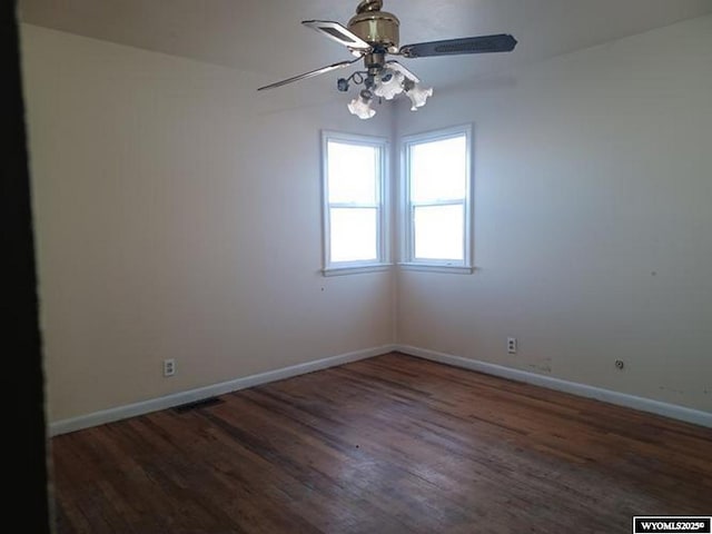1711 Elk Ave, Casper, WY 82601 - unfurnished room with wood finished floors, baseboards, and ceiling fan