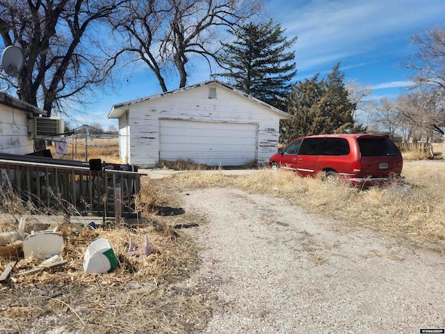 100 Dubuque Ave, Fort Laramie, WY 82212 - detached garage featuring central AC