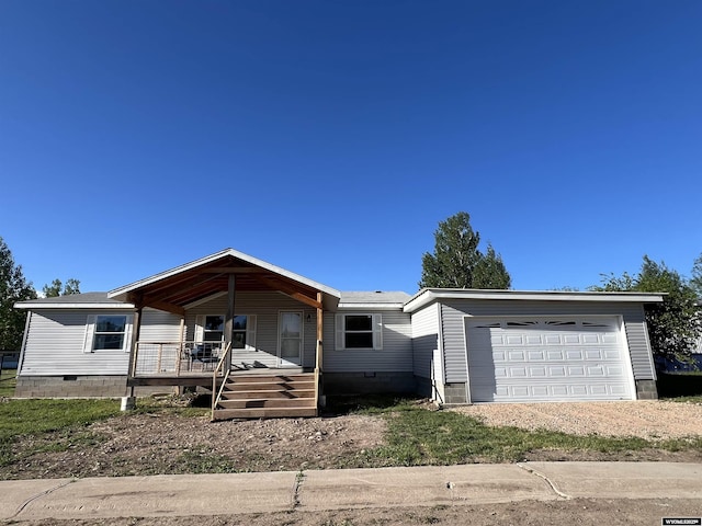 42 Carothers Ave, Fort Bridger, WY 82933 - manufactured / mobile home featuring a porch, crawl space, and dirt driveway