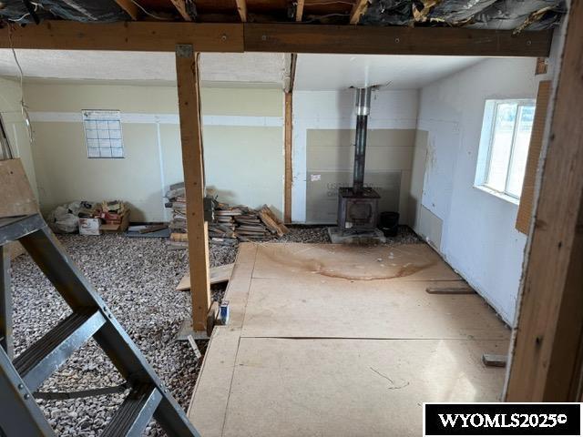 misc room with a wood stove