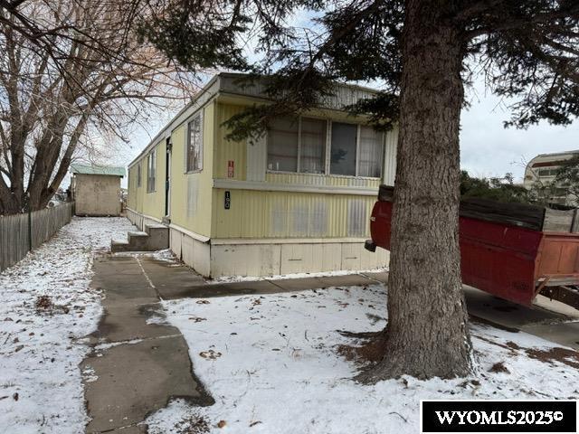 exterior space with entry steps and fence