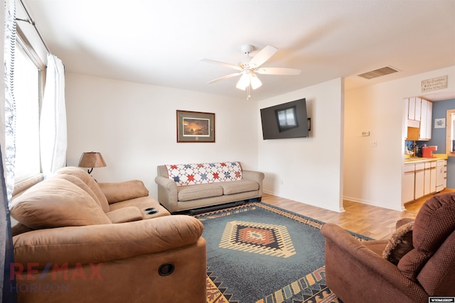 1242 Frontier Dr, Douglas, WY 82633 - living room with a wealth of natural light, visible vents, light wood finished floors, and ceiling fan
