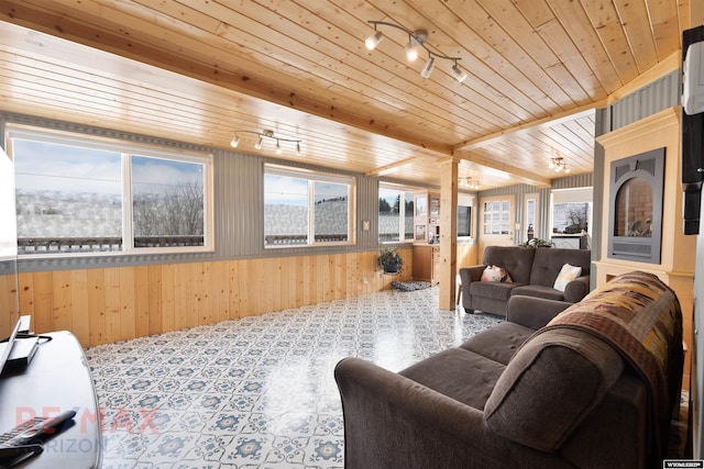 1242 Frontier Dr, Douglas, WY 82633 - carpeted living room with wooden walls, wooden ceiling, and rail lighting