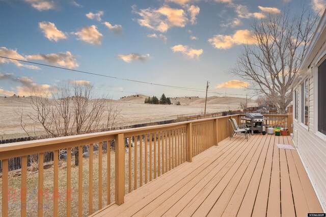 1242 Frontier Dr, Douglas, WY 82633 - deck at dusk featuring a grill