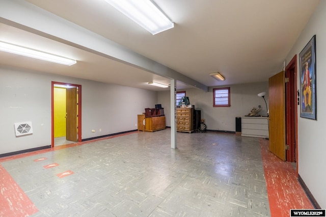 below grade area with visible vents and baseboards