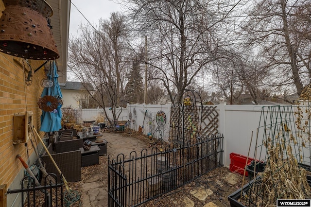 view of yard featuring a patio and a fenced backyard