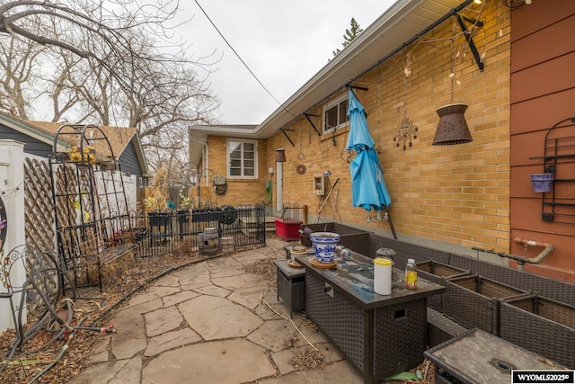 view of patio featuring fence