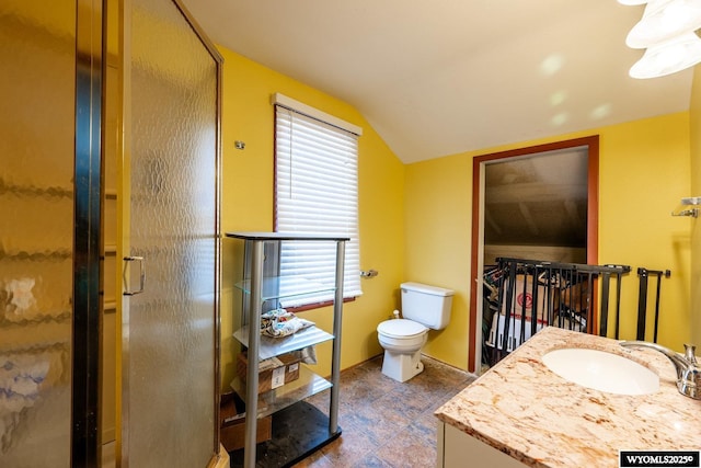 368 N Bozeman Ave, Buffalo, WY 82834 - bathroom featuring vanity, toilet, a shower stall, and vaulted ceiling