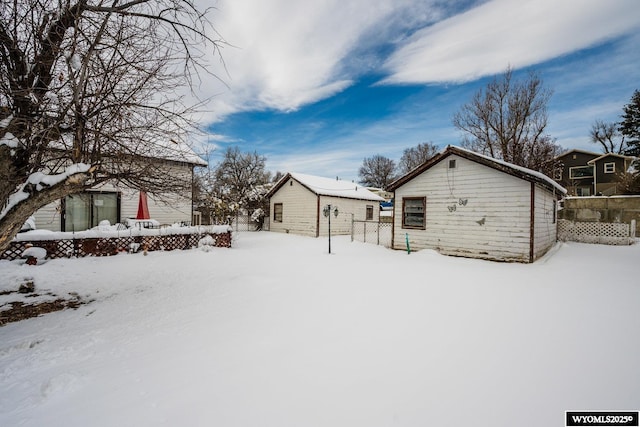 368 N Bozeman Ave, Buffalo, WY 82834 - snow covered property with an outbuilding and fence