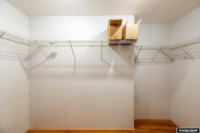 368 N Bozeman Ave, Buffalo, WY 82834 - walk in closet featuring wood finished floors