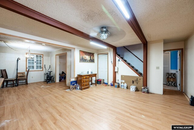 368 N Bozeman Ave, Buffalo, WY 82834 - interior space featuring a textured ceiling, wood finished floors, and stairs